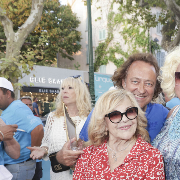 Nicoletta et son mari Jean-Christophe Molinier, Zize lors d'un tournoi de pétanque place des Lices organisé par le magazine Turquoise pour l'association Sourire à la vie à Saint-Tropez le 10 août 2022. © Jack Tribeca / Bestimage
