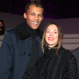 Info - Sortie le 4 mars de "Multitude" nouvel album de Stromae - Stromae (nouvelle coupe de cheveux) et sa femme Coralie Barbier au défilé "Victoria's Secret Paris 2016" au Grand Palais à Paris, le 30 novembre 2016. © Denis Guignebourg/Bestimage  Celebrities attend "Victoria's Secret Paris 2016" fashion show held at the Grand Palais in Paris. November 30th, 2016. 