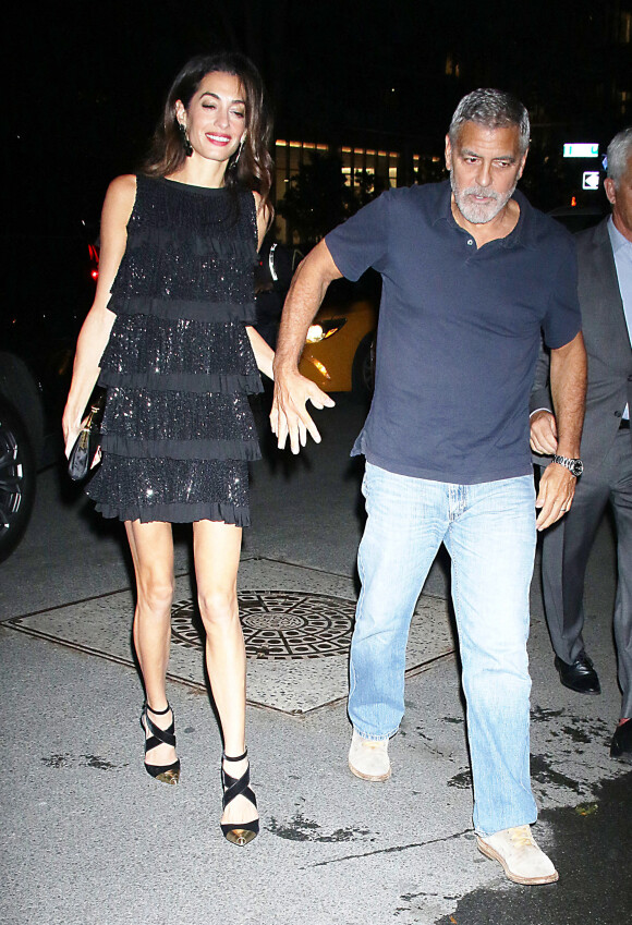 George Clooney et sa femme Amal arrivent à l'hôtel "The Whitby" à New York, le 22 septembre 2022. 