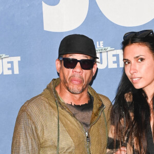 JoeyStarr et une amie - Avant-première du film "Le Nouveau Jouet" au Grand Rex à Paris le 9 octobre 2022. © Coadic Guirec/Bestimage