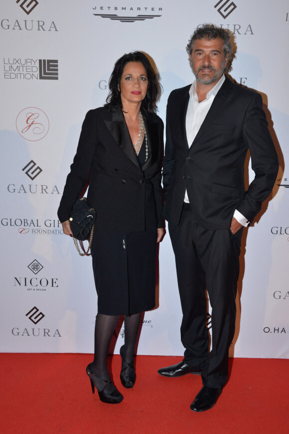 Exclusif - Daniel Lévi et  Sandrine au dîner caritatif "The Global Gift Initiative" au Carlton Beach Club lors du 71ème Festival International du Film de Cannes, le 11 mai 2018. © CVS/Bestimage