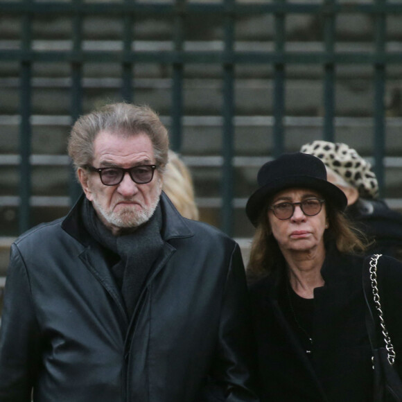 Eddy Mitchell et sa femme Muriel - Sorties de l'église de la Madeleine après les obsèques de Johnny Hallyday à Paris - Le 9 décembre 2017.