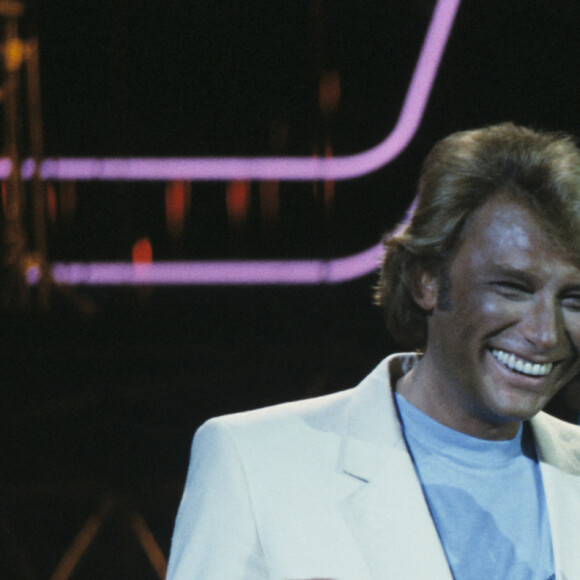 En France, à Paris, sur le plateau de l'émission "Formule 1 +1", Eddy Mitchell et Johnny Hallyday. Le 26 avril 1982. © Bernard Leguay via Bestimage.