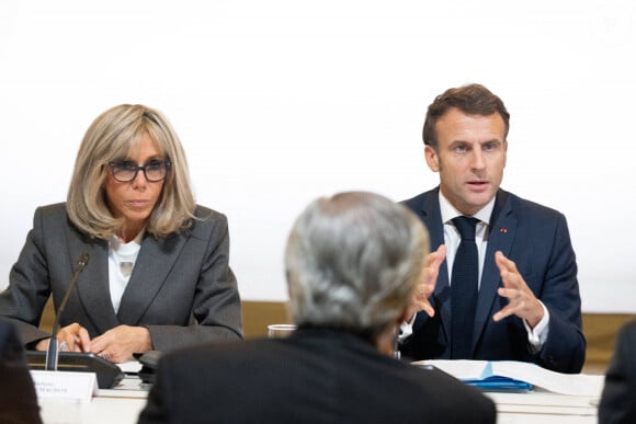 Le président de la République française, Emmanuel Macron et sa femme la Première dame, Brigitte Macron au lancement du Laboratoire pour la protection de l'enfance en ligne au palais de l'Elysée à Paris