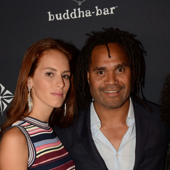 Christian Karembeu et sa femme Jackie Chamoun - A l'occasion des 20 ans de la victoire de l'équipe de France, les bleus 98 se sont rendus à un dîner organisé au Buddha Bar avec tous les joueurs et leur famille le 11 juin 2018. © Rachid Bellak/Bestimage