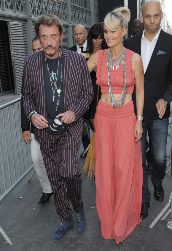 Johnny Hallyday et sa femme Laeticia Hallyday - Défilé Saint Laurent Homme collection Printemps-Eté 2016 au Carreau du Temple lors de la Fashion Week à Paris, le 28 juin 2015.