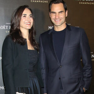 Berta de Pablos- Barbier et Roger Federer au photocall de la soirée "Moët & Chandon" à New York, le 5 décembre 2022. 