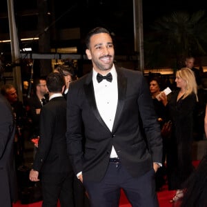 Adil Rami - Montée des marches du film "Novembre" lors du 75ème Festival International du Film de Cannes, le 22 mai 2022. © Cyril Moreau / Bestimage