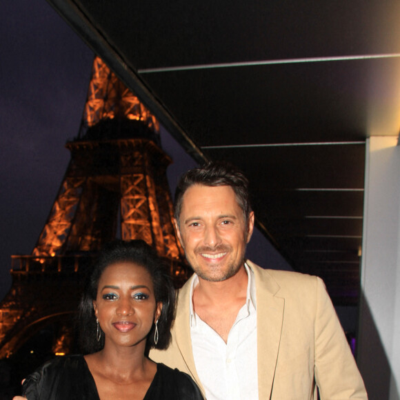 Exclusif - Hapsatou Sy et son mari Vincent Cerruti - Le Grand Dîner du 14 juillet, sur le rooftop de l'hôtel Pullman Tour Eiffel à Paris, France, le 14 juillet 2021. © Philippe Baldini/Bestimage 