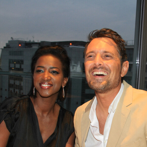 Exclusif - Hapsatou Sy et son mari Vincent Cerruti - Le Grand Dîner du 14 juillet, sur le rooftop de l'hôtel Pullman Tour Eiffel à Paris, France, le 14 juillet 2021. © Philippe Baldini/Bestimage 