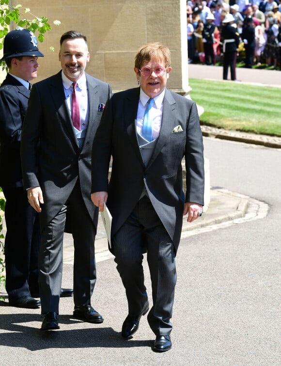 David Furnish et Elton John - Les invités à la sortie de la chapelle St. George au château de Windsor, Royaume Uni, le 19 mai 2018. 