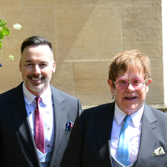 David Furnish et Elton John - Les invités à la sortie de la chapelle St. George au château de Windsor, Royaume Uni, le 19 mai 2018. 