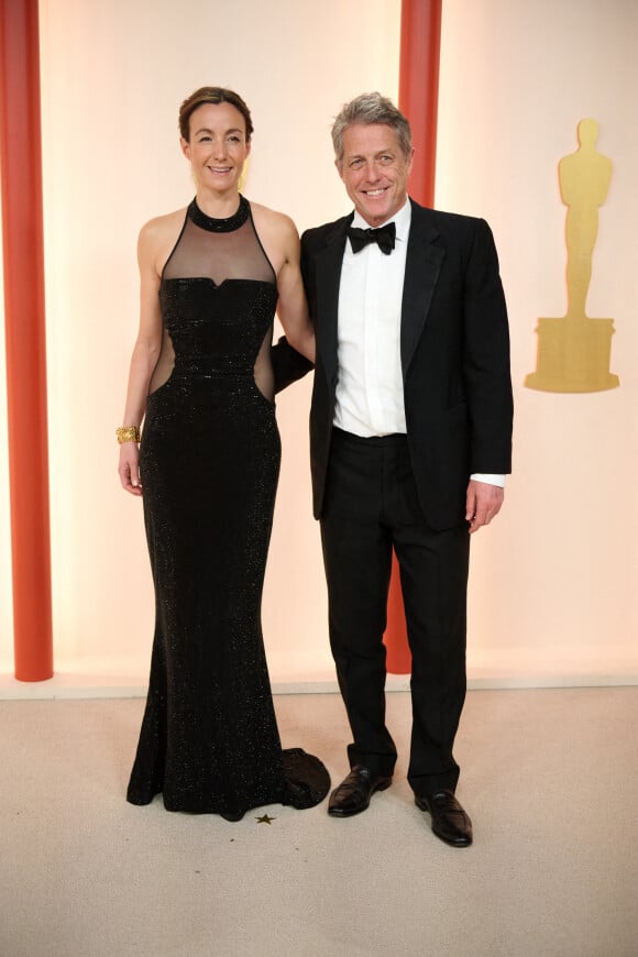 Interviewé par Ashley Graham, il s'est montré particulièrement désagréable.
Hugh Grant, Anna Elisabet Eberstein au photocall de la 95ème édition de la cérémonie des Oscars à Los Angeles, le 12 mars 2023. 