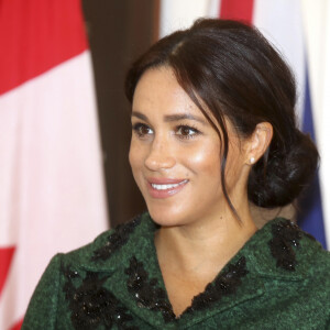 Meghan Markle la duchesse de Sussex enceinte et le prince Harry, duc de Sussex, assistent à une activité jeunesse le Jour du Commonwealth à la Maison du Canada le 11 mars 2019 à Londres