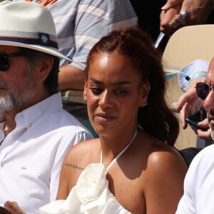 Amel Bent, Patrick Antonelli dans les tribunes de Roland-Garros le 10 juin 2023. Photo by Nasser Berzane/ABACAPRESS.COM