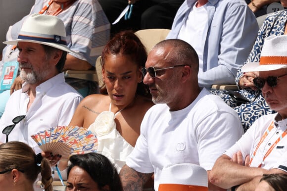 Amel Bent, Patrick Antonelli dans les tribunes de Roland-Garros le 10 juin 2023. Photo by Nasser Berzane/ABACAPRESS.COM