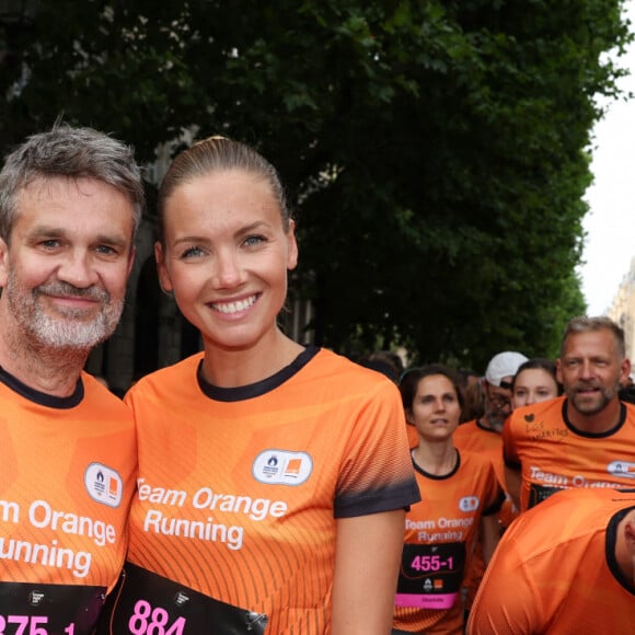 Amandine Petit (Miss France 2021) et Hervé Mathoux (journaliste) lors du marathon Orange Night Run, une boucle de 5,274 km le long des quais de Seine, pour tenter de remporter l'un des 1000 dossards pour le Marathon Pour Tous des Jeux Olympiques de Paris 2024, à Paris, France, le 17 juin 2023. © Jeremy Melloul/Bestimage