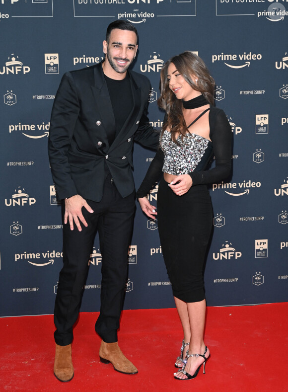 Adil Rami et sa compagne Léna Guillou - Photocall de la cérémonie des Trophées UNFP 2022 au Pavillon Gabriel à Paris le 15 mai 2022. © Coadic Guirec/Bestimage