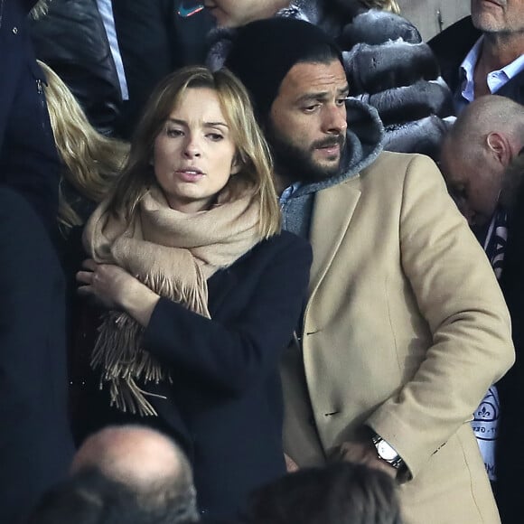 C'est ensemble qu'ils ont célébré l'anniversaire d'un de leurs amis.
Maxim Nucci et sa compagne Isabelle Ithurburu enceinte assistent au huitième de finale retour de Ligue des Champion, du Paris Saint-Germain contre le Real Madrid au Parc des Princes à Paris le 6 mars 2018. © Cyril Moreau/Bestimage