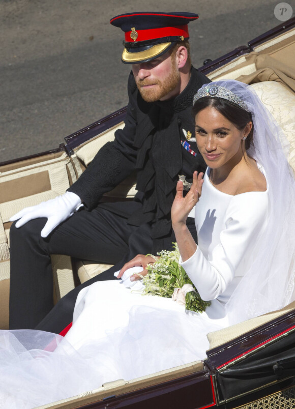 Le prince Harry, duc de Sussex, et Meghan Markle, duchesse de Sussex, en calèche au château de Windsor après la cérémonie de leur mariage au château de Windsor, Royaume Uni, le 19 mai 2018. 