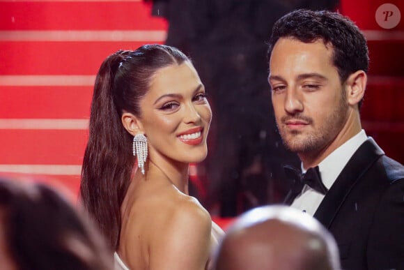 Iris Mittenaere et son fiancé Diego El Glaoui - Montée des marches du film " Le retour (Homecoming) " lors du 76ème Festival International du Film de Cannes, au Palais des Festivals à Cannes. Le 17 mai 2023 © Christophe Clovis / Bestimage