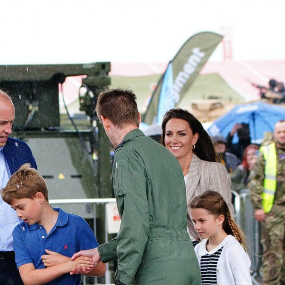 Le prince William, prince de Galles, et Catherine (Kate) Middleton, princesse de Galles, avec leurs enfants le prince George de Galles, et la princesse Charlotte de Galles, lors d'une visite au Royal International Air Tattoo (RIAT) à RAF Fairford, le 14 juillet 2023. 