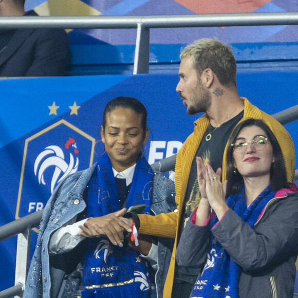 M. Pokora (Matt Pokora), sa femme Christina Milian assistent au match de la 5ème et avant-dernière journée de Ligue des nations entre la France et l'Autriche (2-0) au Stade de France à Saint-Denis le 22 septembre 2022.
