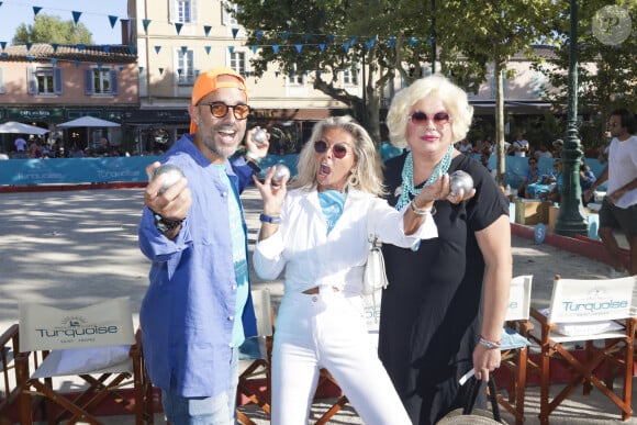 Marc Fichel, Caroline Margeridon, Zize lors d'un tournoi de pétanque caritatif organisé par Turquoise magazine au profit de l'association "Sourire à la vie" (association qui soutient les enfants atteints du cancer ) place des Lices à Saint-Tropez le 13 août 2023. © Jack Tribeca / Bestimage 