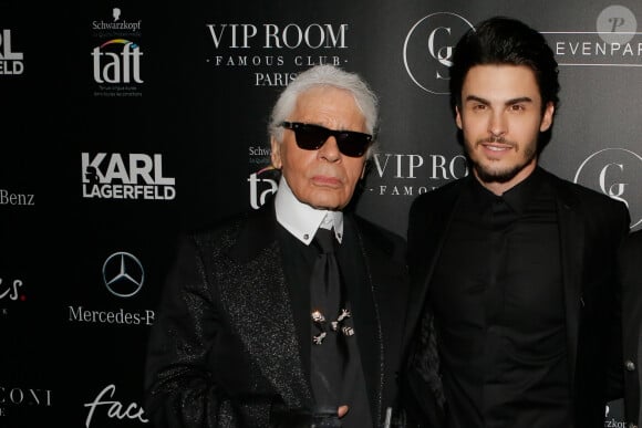 Ils pourraient tout de même avoir plusieurs millions d'euros.
Karl Lagerfeld et Baptiste Giabiconi - Soirée "Giabiconistyle.com opening" au Vip Room à Paris le 28 février 2015 