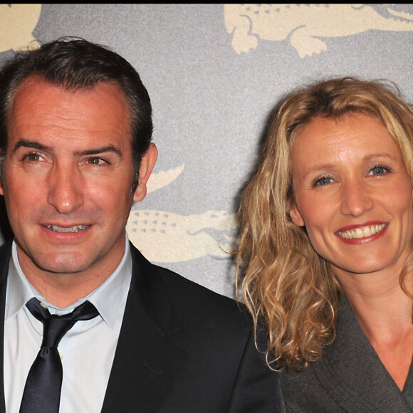 Jean Dujardin, Alexandra Lamy- Soirée QG "hommes de l'année 2011" à l'hotel du Ritz à Paris le 18 janvier 2011.