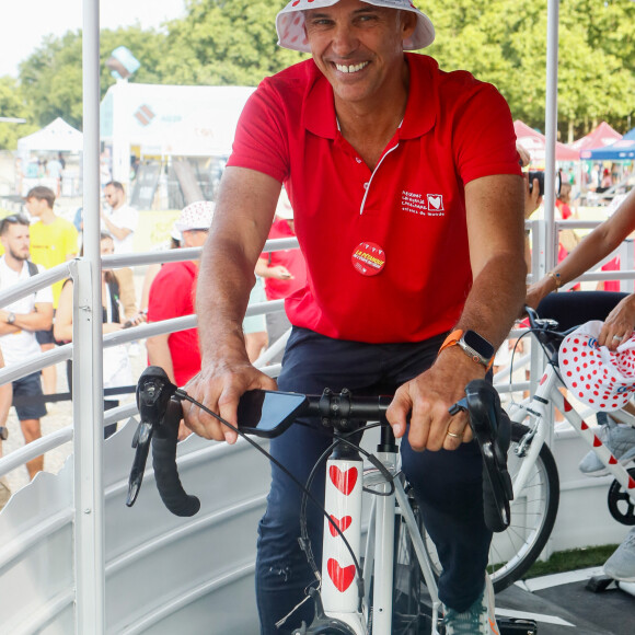 Exclusif - Paul Belmondo - Animation "Sommets du coeur" lors de la 20ème édition de "l'étape du coeur" de l'association "Mécénat Chirurgie Cardiaque" (MCC) lors du tour de France 2023 au Fan Park à Bordeaux, France, le 06 juillet 2023. © Christophe Clovis / Bestimage 