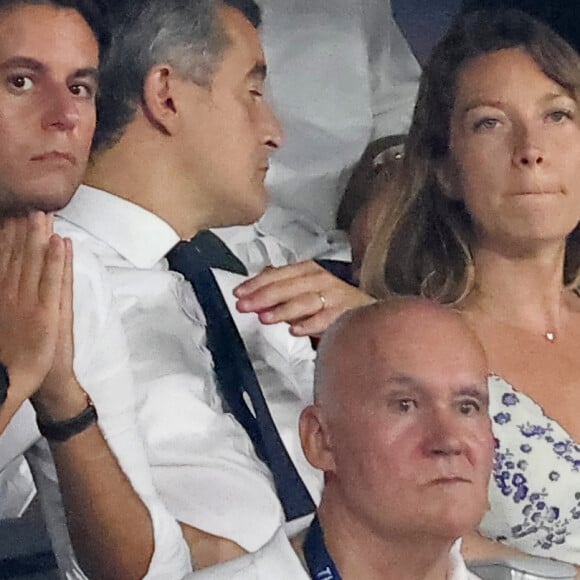 Gabriel Attal, Gérald Darmanin, ministre de l'Intérieur et sa femme Rose-Marie Devillers - People dans les tribunes lord du match d'ouverture de la Coupe du Monde de Rugby France 2023 avant le match de la Poule A entre la France et la Nouvelle-Zélande au Stade de France à Saint-Denis le 8 septembre 2023. © Dominique Jacovides/Bestimage 