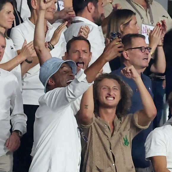 Yannick Noah et son fils Joalukas - People dans les tribunes lord du match d'ouverture de la Coupe du Monde de Rugby France 2023 avant le match de la Poule A entre la France et la Nouvelle-Zélande au Stade de France à Saint-Denis le 8 septembre 2023. © Dominique Jacovides/Bestimage