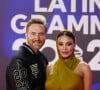 Le couple avait préparé son coup puisqu'il a attendu d'être aux Latin Grammy Awards 2023 à Séville, en Espagne, pour officialiser
David Guetta et sa compagne Jessica Ledon, enceinte, lors du photocall de la cérémonie des "Latin Grammy Awards 2023" à Séville, le 16 novembre 2023.