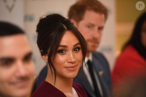 Le prince Harry et Meghan Markle participent à une réunion sur l'égalité des genres avec les membres du Queen's Commonwealth Trust et du sommet One Young World au château de Windsor, le 25 octobre 2019.