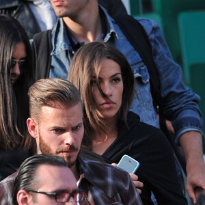 M. Pokora et sa compagne Scarlett Baya assistent aux Internationaux de France de tennis de Roland-Garros à Paris le 2 juin 2014.