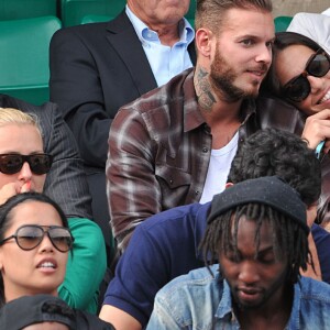 M. Pokora et sa compagne Scarlett Baya assistent aux Internationaux de France de tennis de Roland-Garros à Paris le 2 juin 2014.