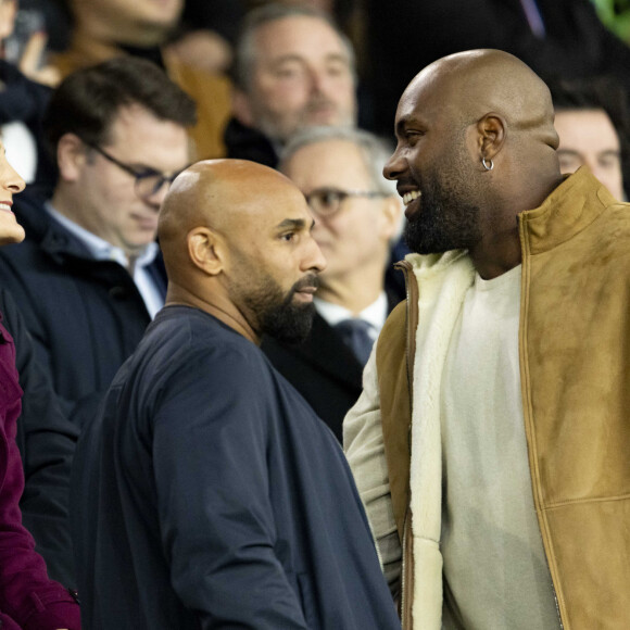 Amélie Oudéa Castéra (ministre des Sports et des Jeux Olympiques et Paralympiques), Teddy Riner - Célébrités dans les tribunes du match aller des huitièmes de finale de la Ligue des champions entre le PSG et la Real Sociedad (2-0) au Parc des Princes à Paris le 14 février 2024. © Cyril Moreau/Bestimage