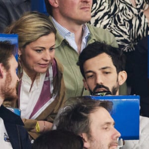 Laure Boulleau, Florian Ordonez (Bigflo) - Célébrités dans les tribunes du match de Ligue 1 Uber Eats "PSG-Toulouse" (1-3) au Parc des Princes à Paris le 12 mai 2024. © Cyril Moreau/Bestimage