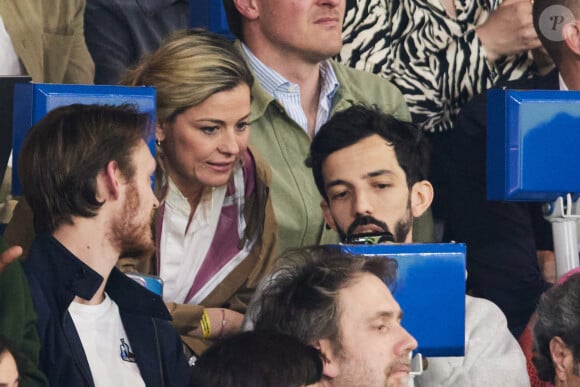 Laure Boulleau, Florian Ordonez (Bigflo) - Célébrités dans les tribunes du match de Ligue 1 Uber Eats "PSG-Toulouse" (1-3) au Parc des Princes à Paris le 12 mai 2024. © Cyril Moreau/Bestimage