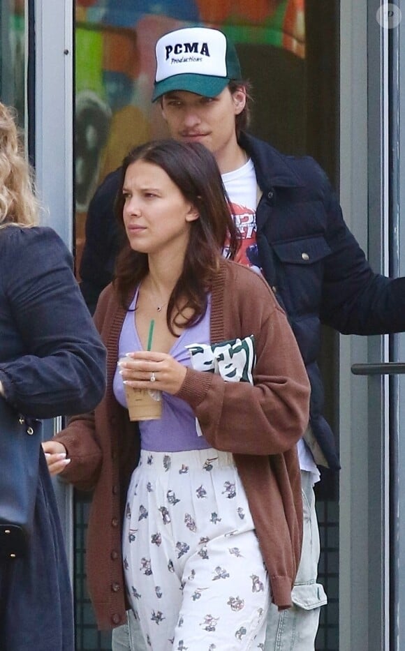 New York City, NY - EXCLUSIVE - Millie Bobby Brown steps out in pajamas for a coffee run with fiance Jake Bongiovi while out in Manhattan’s Downtown area. Millie is currently filming the Final Season of “Stranger Things”. Pictured: Millie Bobby Brown, Jake Bongiovi 