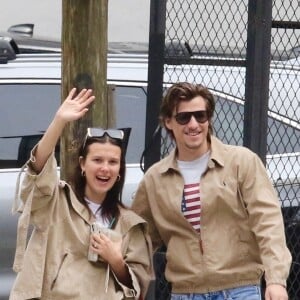 EXCLUSIVE - Millie Bobby Brown and her fiance Jake Bongiovi are all smiles as they coordinate in style sporting color-matching jackets and jeans during a romantic outing in Manhattan’s Downtown area. The engaged couple were in great spirits as they happily waved to the photographer. Millie is currently filming the final season of Stranger Things. SHOT ON 04/19/2024 