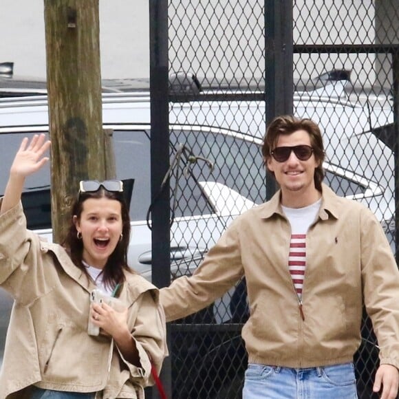 EXCLUSIVE - Millie Bobby Brown and her fiance Jake Bongiovi are all smiles as they coordinate in style sporting color-matching jackets and jeans during a romantic outing in Manhattan’s Downtown area. The engaged couple were in great spirits as they happily waved to the photographer. Millie is currently filming the final season of Stranger Things. SHOT ON 04/19/2024 