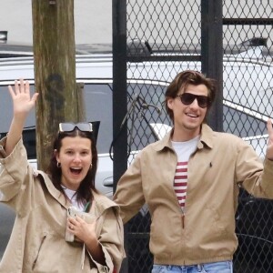 EXCLUSIVE - Millie Bobby Brown and her fiance Jake Bongiovi are all smiles as they coordinate in style sporting color-matching jackets and jeans during a romantic outing in Manhattan’s Downtown area. The engaged couple were in great spirits as they happily waved to the photographer. Millie is currently filming the final season of Stranger Things. SHOT ON 04/19/2024 