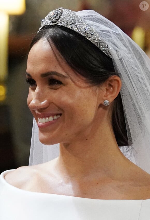 Comme on l'apprend, plus de 750 000 euros de ces précieux objets proviennent de la collection de la princesse Diana.
Meghan Markle à son mariage en 2018. Photo by Jonathan Brady/PA Wire/ABACAPRESS.COM