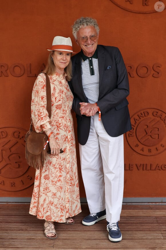 Nelson Monfort et sa femme au Village lors des Internationaux de France 2024 à Roland Garros le 8 juin 2024. Nasser Berzane/ABACAPRESS.COM