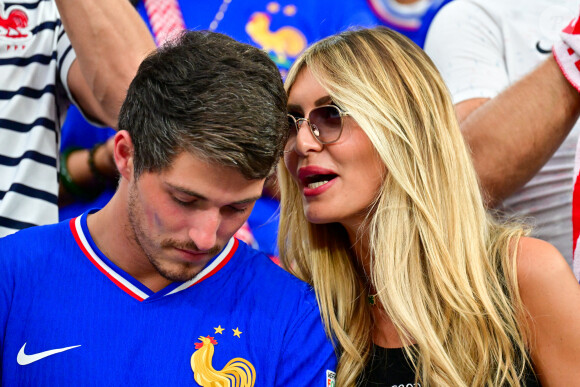 Dylan Deschamps et sa fiancée Mathilde Cappelaere dans les tribunes de la demi-finale du Championnat d'Europe de football (Euro 2024) entre l'Espagne et la France (2-1) à Munich, Allemagne, le 9 juillet 2024. © Bestimage