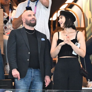 John Travolta et sa fille Ella Bleu assistent aux épreuves de gymnastique lors des Jeux Olympiques de Paris2024 (JO) le 3 aout 2024. © Perusseau-Jacovides-Bestimage 