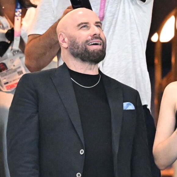 John Travolta et sa fille Ella Bleu assistent aux épreuves de gymnastique lors des Jeux Olympiques de Paris2024 (JO) le 3 aout 2024. © Perusseau-Jacovides-Bestimage 