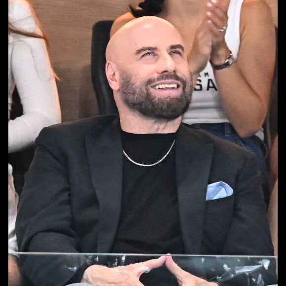 Face au photographe, le père de famille s'est affiché très souriant.
John Travolta et sa fille Ella Bleu assistent aux épreuves de gymnastique lors des Jeux Olympiques de Paris2024 (JO) le 3 aout 2024. © Perusseau-Jacovides-Bestimage 